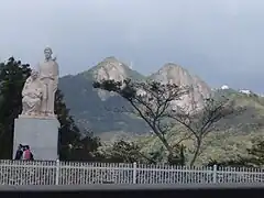 Tourists at the monument with Las Tetas De Cayey
